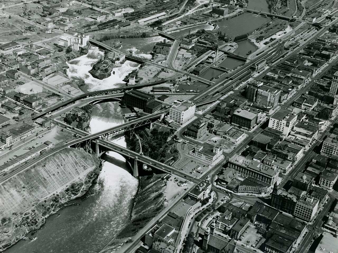 Black and white aerial photograph of downtown Spokane in the 1950s showing rail lines.