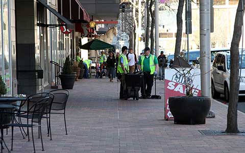 Volunteers Cleaning Downtown Sidewalk