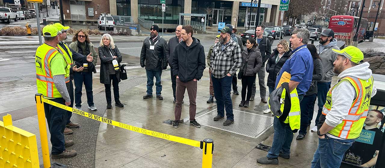 A tour group at the Place of Truths Plaza learning about the CSO tank