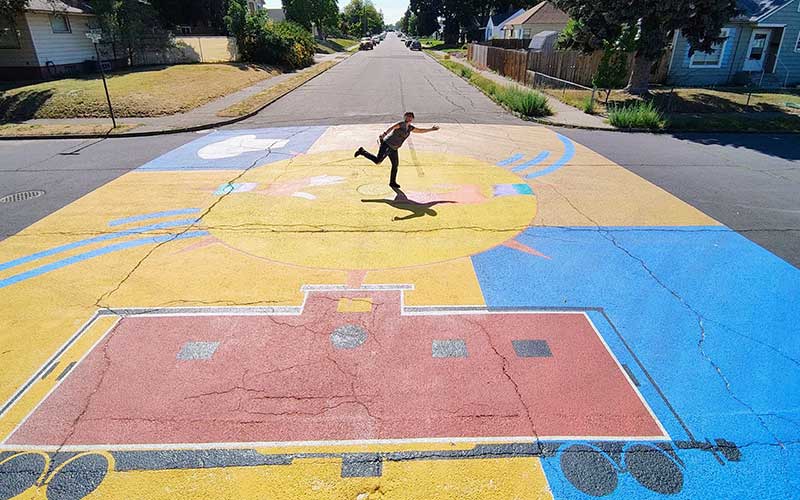 Asphalt mural at the Cook-Joseph intersection in Hillyard