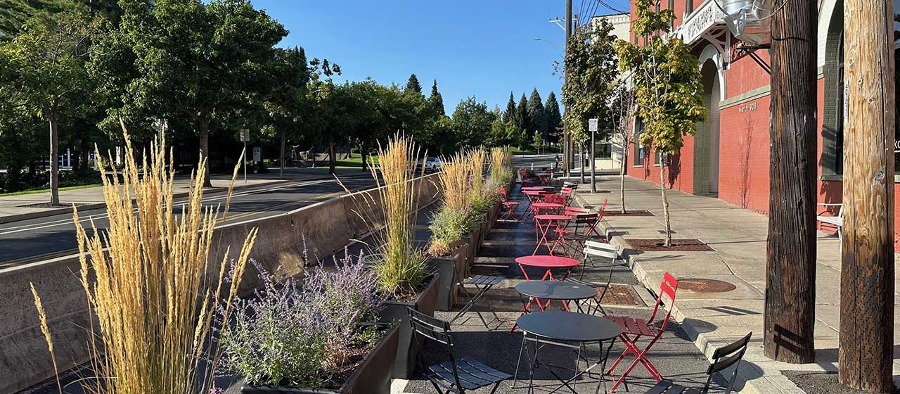 Howard Street Public Plaza -sidewalk with red and black tables and chairs