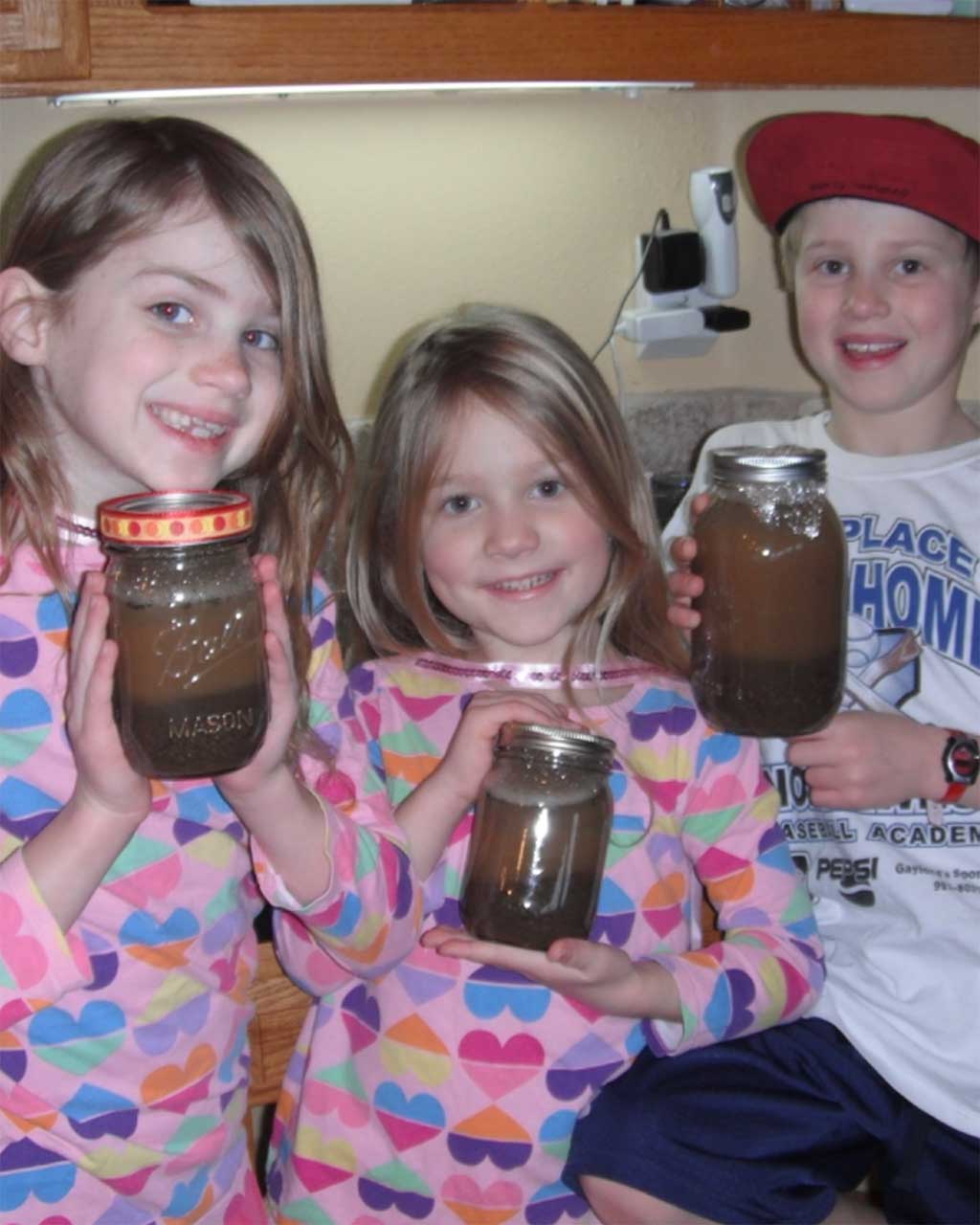 Kids conducting soil experiment