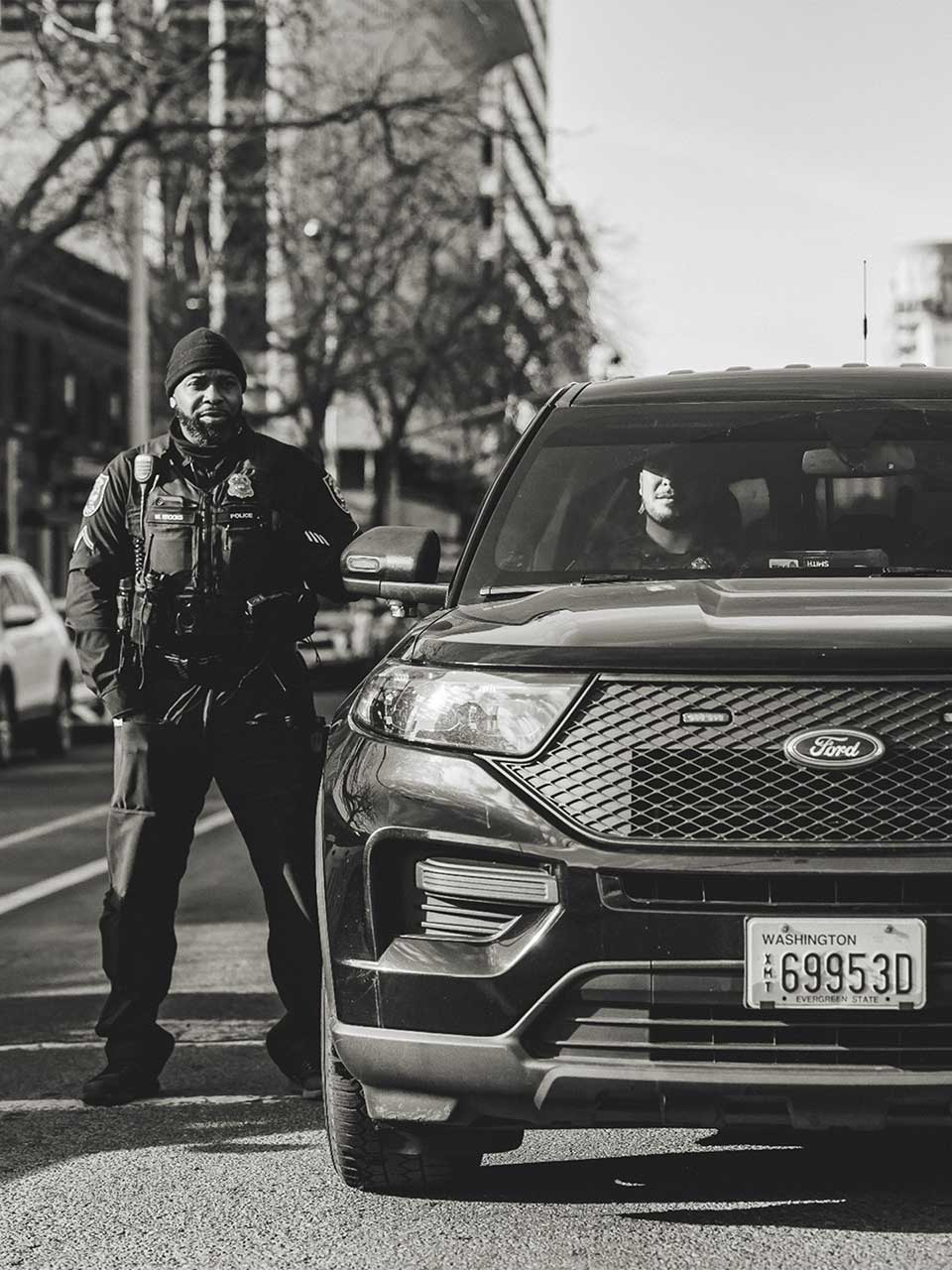 Spokane Police Department officers and vehicle